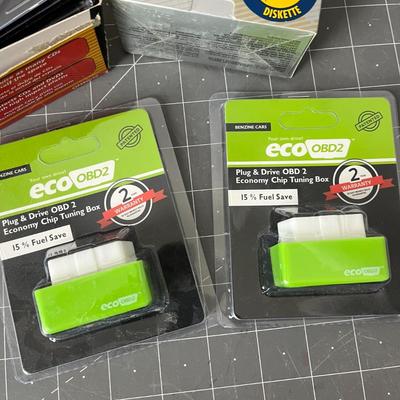 Eco OBD2 Vehicle Chip Box, CD Cases, and Floppy Disks