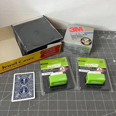 Eco OBD2 Vehicle Chip Box, CD Cases, and Floppy Disks
