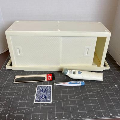 Medicine Cabinet, Thermometers, and Comb