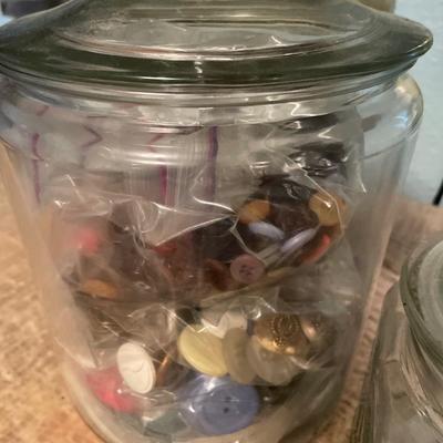 Glass jars with buttons