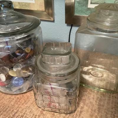 Glass jars with buttons