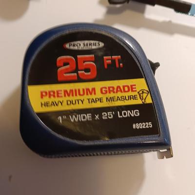 Pro series 25-foot tape measure - Hack saw - Emery cloth roll - and a Stanley adjustable bevel Angle