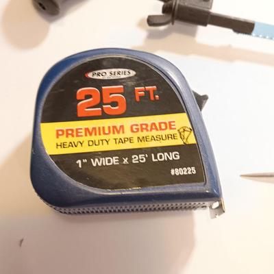 Pro series 25-foot tape measure - Hack saw - Emery cloth roll - and a Stanley adjustable bevel Angle