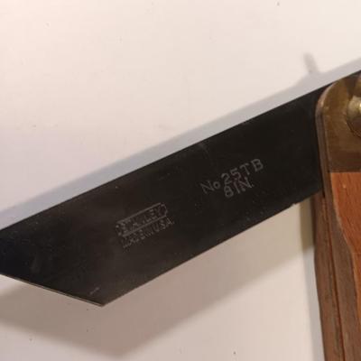 Pro series 25-foot tape measure - Hack saw - Emery cloth roll - and a Stanley adjustable bevel Angle