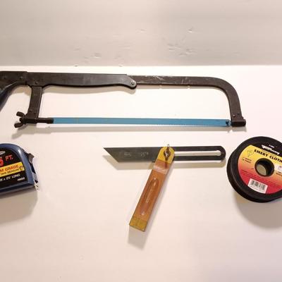Pro series 25-foot tape measure - Hack saw - Emery cloth roll - and a Stanley adjustable bevel Angle