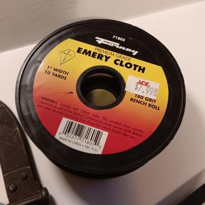 Pro series 25-foot tape measure - Hack saw - Emery cloth roll - and a Stanley adjustable bevel Angle