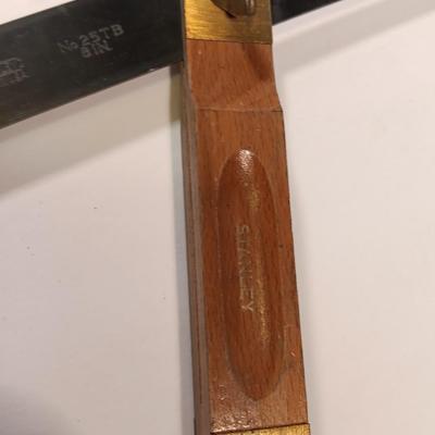 Pro series 25-foot tape measure - Hack saw - Emery cloth roll - and a Stanley adjustable bevel Angle