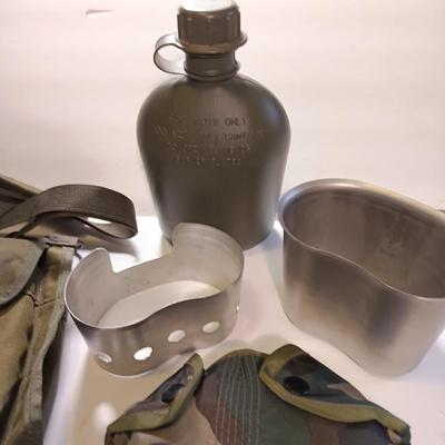 Army Bandoleer with camouflage covered canteen.