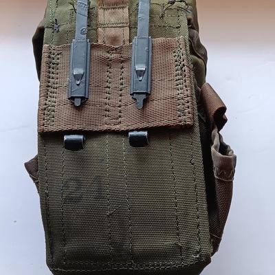 Assortment of military issued bags / pouches and a belt.
