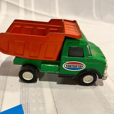 Metal bank and dump truck