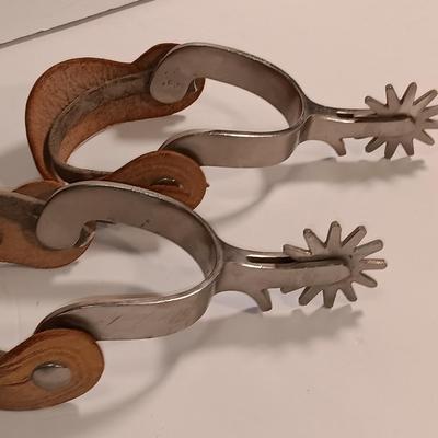 Vintage western Crockett Spurs with leather boot strap engraved with John on the side