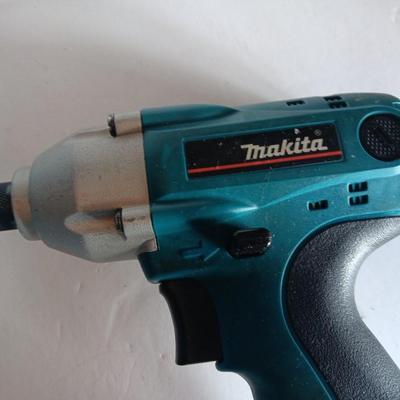 Makita 6932FD 14-volt hammer drill in molded case with accessories