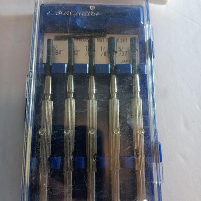 Assortment of hand tools - tape measure - utility knives - level - precision screwdriver set and more