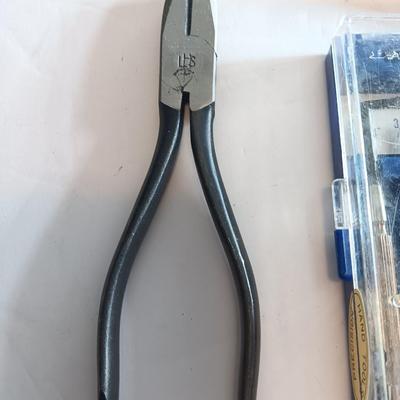 Assortment of hand tools - tape measure - utility knives - level - precision screwdriver set and more