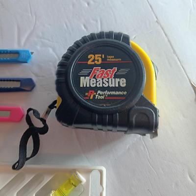 Assortment of hand tools - tape measure - utility knives - level - precision screwdriver set and more