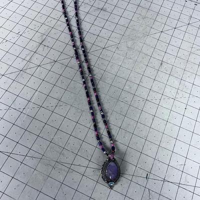 Pretty Purple, Pink, Reddish Beads and Silver Pendant with set Stones. 