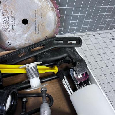 Lot of Work Bench Clean off: Skateboard Trucks, Stapler, Saw Blade