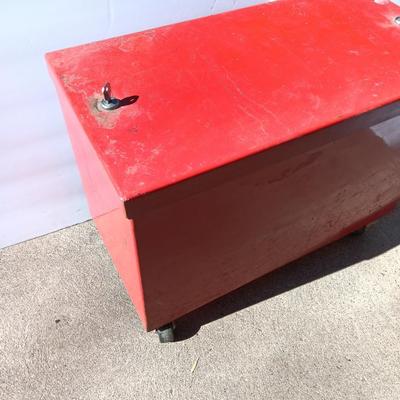 Locking metal box lined with Masonite wood.