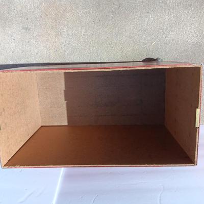 Locking metal box lined with Masonite wood.