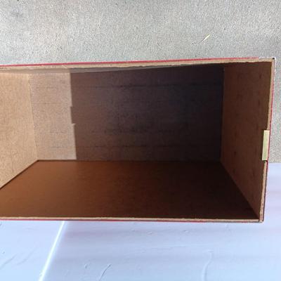 Locking metal box lined with Masonite wood.