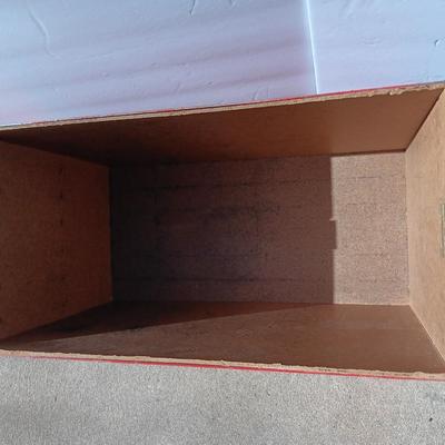 Locking metal box lined with Masonite wood.