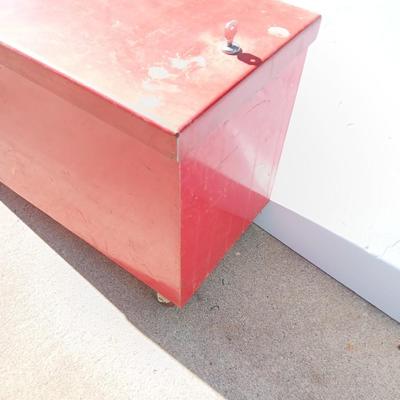 Locking metal box lined with Masonite wood.