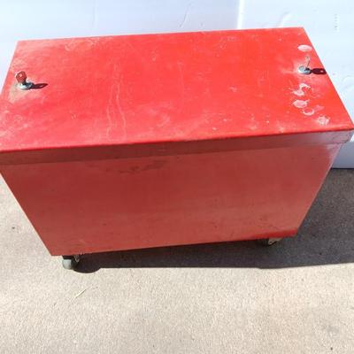 Locking metal box lined with Masonite wood.