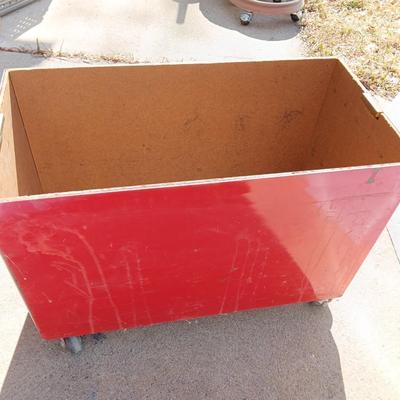 Locking metal box lined with Masonite wood.