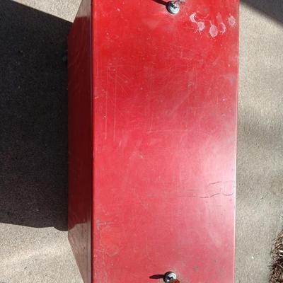 Locking metal box lined with Masonite wood.