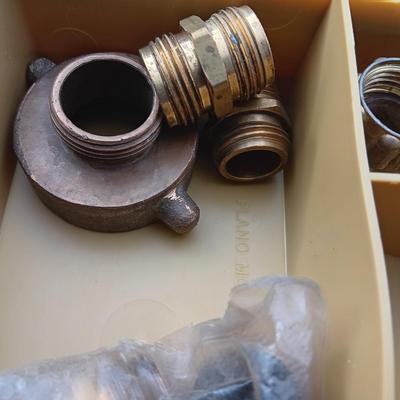 Plano plastic storage cases with an assortment of brass fittings - hose repair and springs