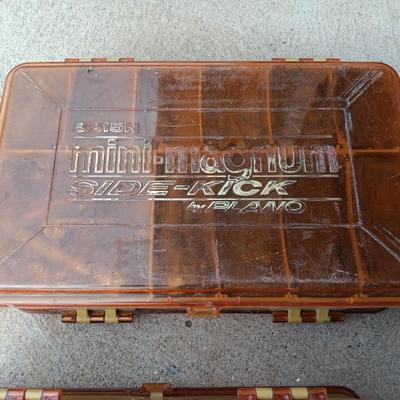 Plano plastic storage cases with an assortment of nuts and bolts