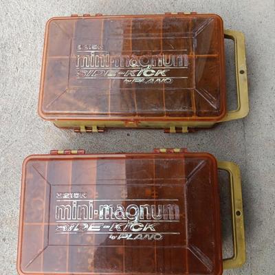 Plano plastic storage cases with an assortment of nuts and bolts