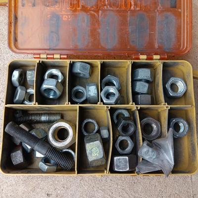 Plano plastic storage cases with an assortment of nuts and bolts