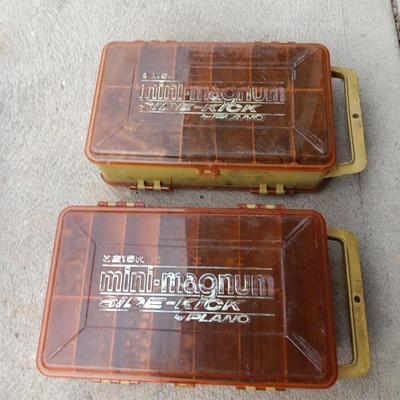 Plano plastic storage cases with an assortment of nuts and bolts
