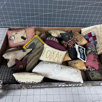 Pin Cushions, Quilted Squares, and Stuffed Animals.