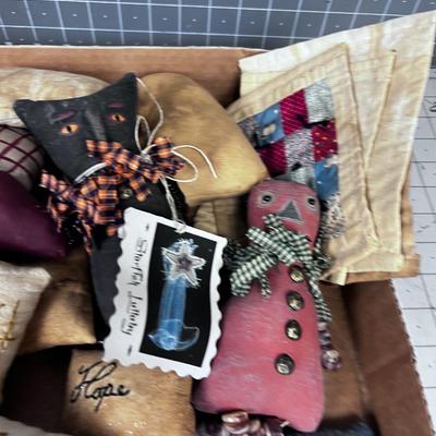 Pin Cushions, Quilted Squares, and Stuffed Animals.