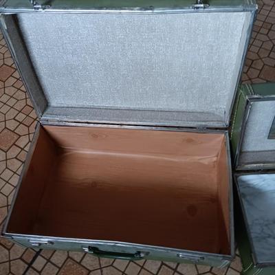 Vintage green suitcase with cosmetic case