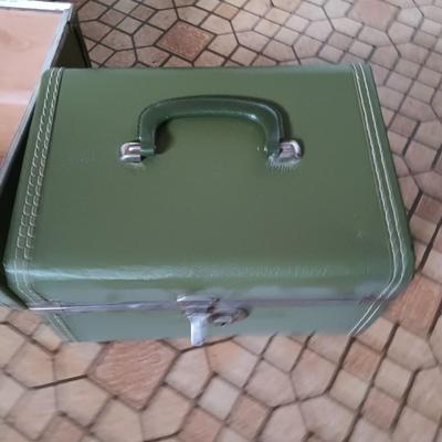 Vintage green suitcase with cosmetic case