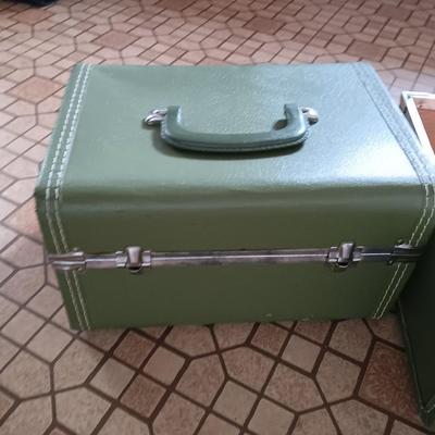 Vintage green suitcase with cosmetic case