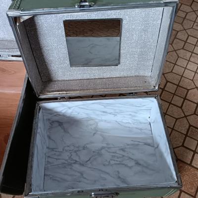 Vintage green suitcase with cosmetic case