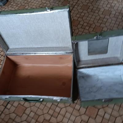 Vintage green suitcase with cosmetic case