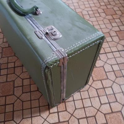 Vintage green suitcase with cosmetic case