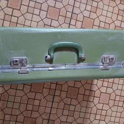 Vintage green suitcase with cosmetic case