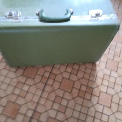 Vintage green suitcase with cosmetic case