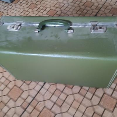 Vintage green suitcase with cosmetic case