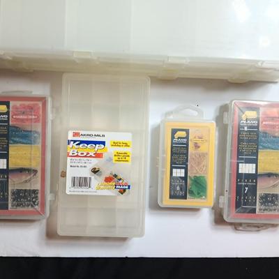 Plastic Plano fishing tackle organizing boxes and others.