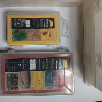 Plastic Plano fishing tackle organizing boxes and others.