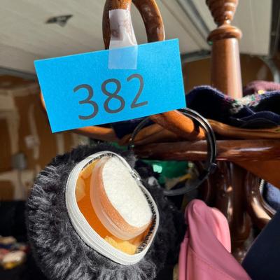 Hall tree full of coats & jackets