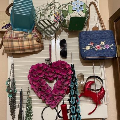 Necklaces and bags on shutter wall decor