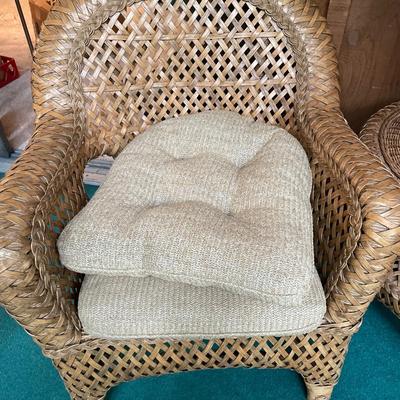 2 wicker chairs and round table